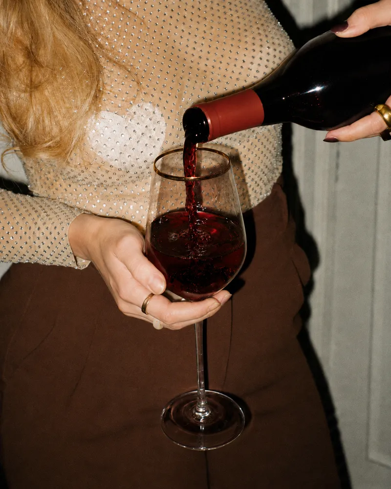 woman pouring glass of wine